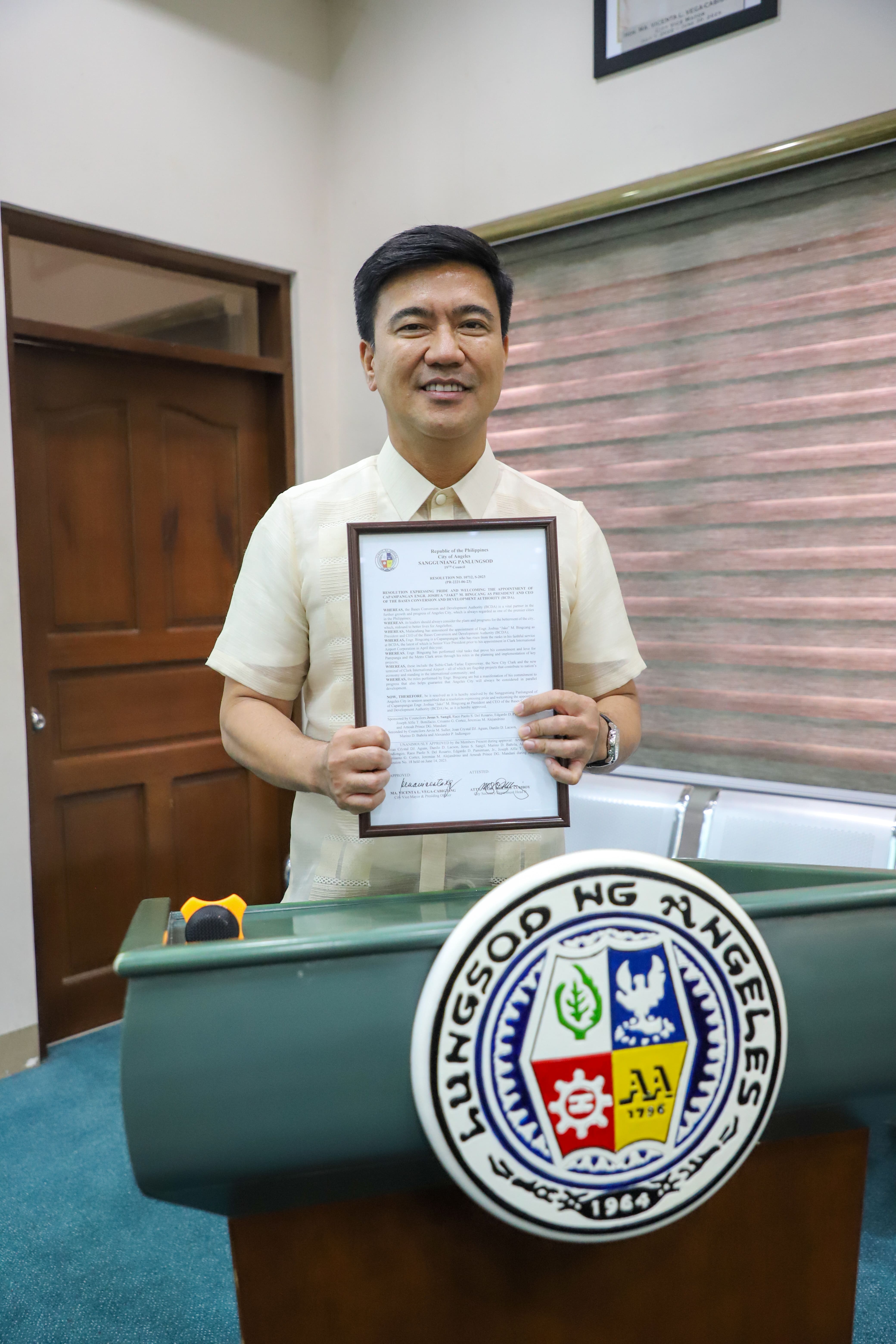 BCDA Joshua M. Bingcang holding a copy of the resolution